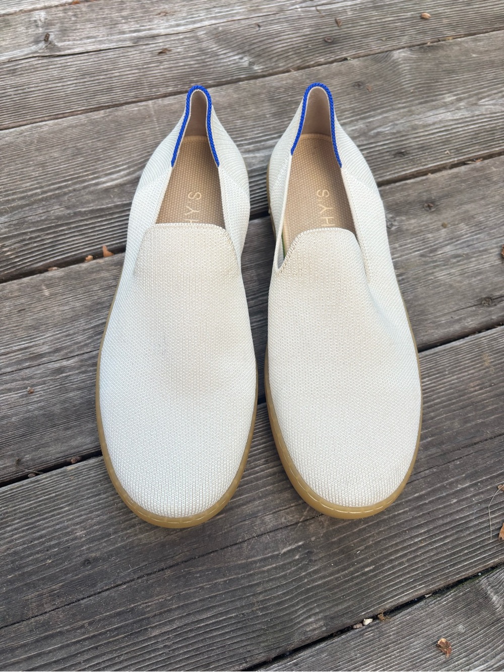Rothy’s women’s Slip-On Canvas Loafers in Off-White with Blue Trim